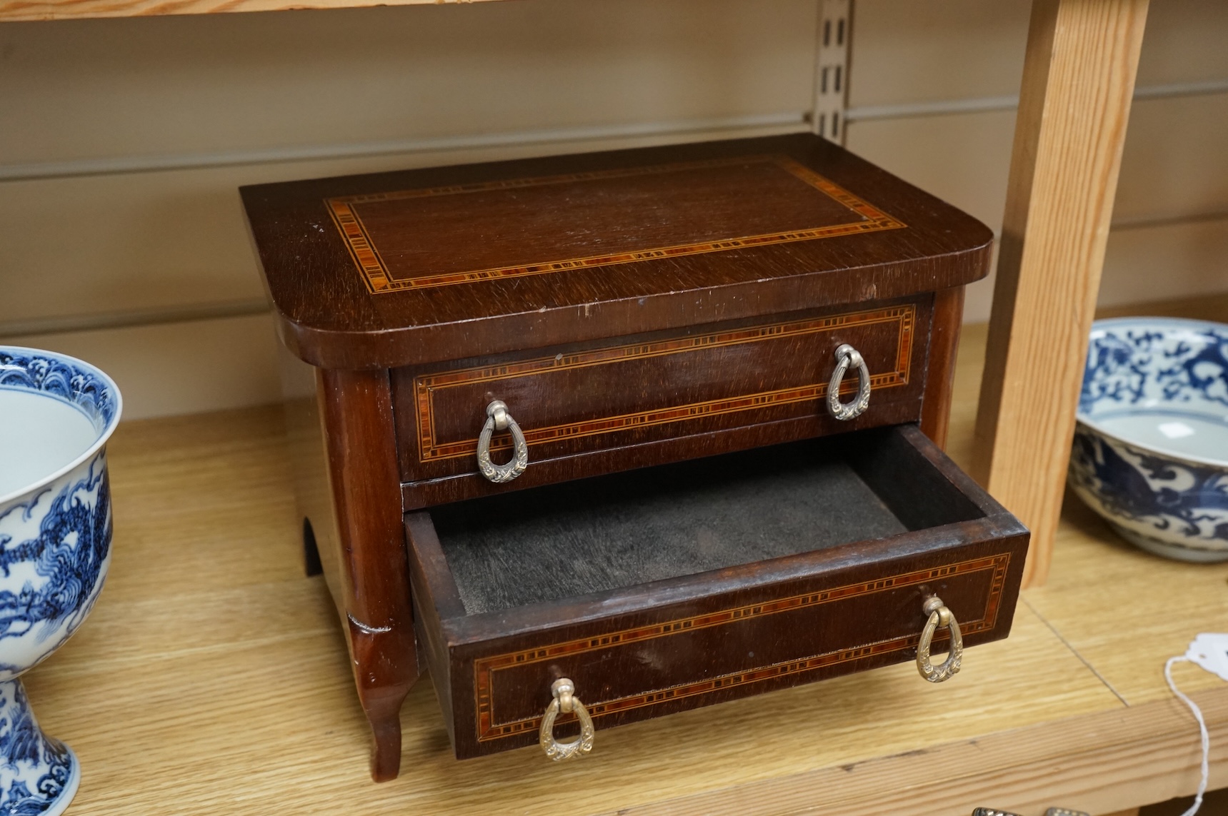 A French miniature lined inlaid mahogany chest of two drawers, 29cm wide